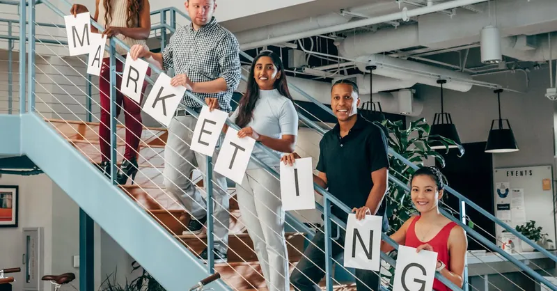 A diverse group of professionals holding 